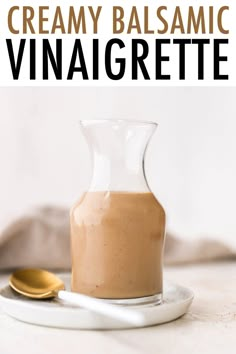 creamy balsamic vinaigrette in a glass carafe on a plate