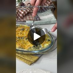 a person is spooning food out of a casserole dish on a table