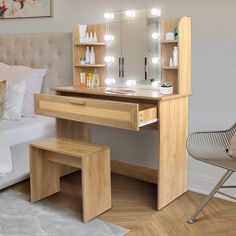 a bedroom with a bed, vanity table and stool in front of a large mirror