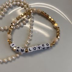 I Am Loved Bracelet Beautiful Gold Tone Semi Precious Beads With Soft Cream Beads Customizable Size Or Message Stretchy Band Perfect For A Special Gift Check Out My Other Bead Bracelets Listings And Bundle For A Discount Gold Pearl Beaded Bracelets With Letter Beads, Beaded Bracelets With Words, Christian Beaded Bracelets, Letter Bracelet Beads, I Am Loved, Faith Bracelet, Bracelets For Boyfriend, Merch Ideas