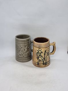 two mugs sitting next to each other on a table