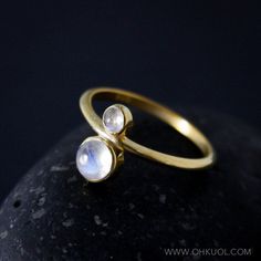 Dreamy and full of mystery, this round rainbow moonstone and birthstone ring makes the perfect personalized gift. It features a round, smooth polished rainbow moonstone, accented with your choice of birthstone. Choose a birthstone that is meaningful to you and also choose your preferred setting in; silver, gold, or rose gold. Stone & Dimensions: Round Rainbow Moonstone 5mm, Your choice of birthstone 3mm Setting: Sterling Silver, with the option to have it *18kt yellow gold plated, or 18kt ro Custom Birthstone Ring, Two Stone Ring, June Birthstone Ring, Writing Gifts, Moonstone Bracelet, June Birthstone, Gold Stone, Multi Stone Ring, June Birth Stone