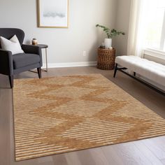 a living room with a couch, chair and rug