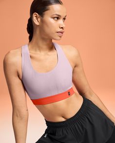 A racerback sports bra designed for short runs and yoga sessions. Providing light support for laid-back days. The Pace Bra is designed to look good and feel even better, featuring a racerback silhouette with light support and no extra padding. Seamlessly taking you from run club to coffee in a laid-back style, wear it on its own or with a layer on top. Why not pair it with the Pace Tank? Made with innovative CleanCloud® polyester, for a material so soft and easy-to-wear that your body will thank Light Support Racerback Sports Bra In Recycled Polyester, Sporty Racerback Sports Bra In Recycled Polyester, Sporty Recycled Polyester Racerback Sports Bra, Recycled Polyester Light Support Racerback Sports Bra, Recycled Polyester Racerback Sports Bra, Seamless Sports Bra In Recycled Polyester, Recycled Polyester Sports Bra, Running 10k, Tempo Run