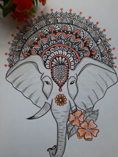 an elephant with flowers on it's head