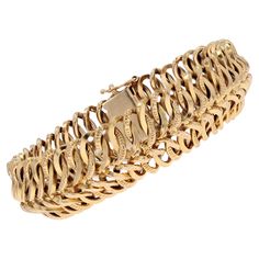 Bracelet in 18 karat yellow gold. Vintage gold bracelet featuring a swath of alternately chased staple motifs. The fastening system is ratchet with 8 and safety chain. Width : 18 mm approximately, thickness : 5 mm approximately, Interior circumference : 17,5 cm approximately. Total weight of the jewel : 26,8 g approximately. Authentic antique jewelry - French work from the 1960s. Our opinion : Very flexible, this antique gold bracelet was very popular in the 1960s. Specialized in antique and cre Chunky Gold Bracelet, Antique Gold Bracelet, Vintage Gold Bracelet, Retro Bracelet, Id Bracelets, Gold Armband, Vintage Gold, Vintage Stil, Antique Gold