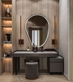 a dressing room with a round mirror on the wall and stool in front of it