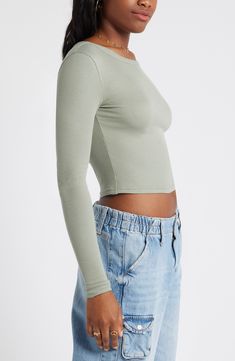 Svelte and stretchy, this finely ribbed crop top is the perfect match for high-rise styles and is polished off by a graceful scoop neckline. 17 1/2" length (size Medium)   Scoop neck   Long sleeves   97% Lenzing™ EcoVero™ viscose, 3% spandex   Lenzing EcoVero viscose is a sustainably produced fiber using pulp made from renewable wood sources and certified with the EU Ecolabel for high environmental standards, including lower emissions and water usage than generic viscose   Machine wash, dry flat Fitted Trendy Crop Top, Chic Fitted Scoop Neck Crop Top, Chic Scoop Neck Elastane Crop Top, Elastane Stretch Crop Top With Scoop Neck, Stretch Elastane Scoop Neck Crop Top, Stretch Elastane Crop Top With Scoop Neck, Seamless Construction Crop Top For Spring, Trendy Seamless Spring Tops, Elastane Scoop Neck Crop Top