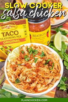 slow cooker salsa chicken in a white bowl with cilantro on the side