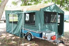 a trailer with a tent attached to it