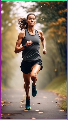 a woman running down a road with trees in the background and leaves on the ground