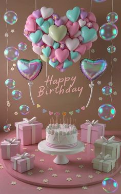 a birthday cake surrounded by balloons and presents on a pink table with confetti