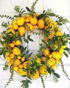 a wreath made out of lemons and greenery is displayed on an instagram page