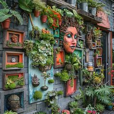 there is a wall with plants on it and a face in the middle, surrounded by potted plants