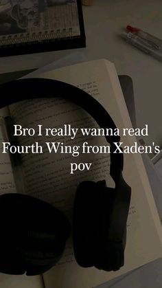 headphones sitting on top of an open book