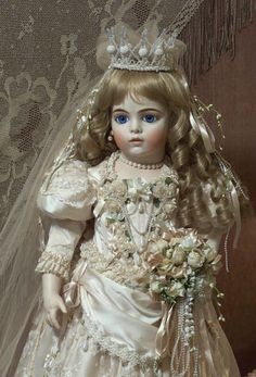 a doll dressed up in a wedding dress