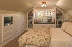 a bedroom with built in bookshelves and a bed