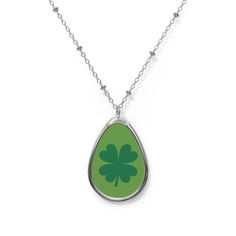 Four Leaf Clover Shamrock Oval Pendant Necklace! This unique and charming necklace is the perfect accessory to showcase your love for luck and Irish symbolism. Crafted with an oval pendant, featuring a beautiful  four leaf clover shamrock, this necklace is a true symbol of good fortune. The pendant hangs elegantly from a dainty chain, adding a touch of sophistication to any outfit. Whether it's for a special occasion or simply to add a touch of Irish charm to your everyday look, this necklace is Oval Drop Necklace For Anniversary, Silver Charm Necklace With Oval Pendant, Anniversary Necklace With Oval Pendant And Charms, Oval Pendant Charm Necklace For Gift, Silver Oval Necklaces With Charms, Oval Charms Necklace For Gift, Oval Charm Necklaces As Gift, Oval Charm Necklaces For Gifts, Oval Pendant Charm Necklaces As Gift