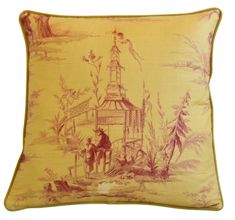 a yellow and red pillow with an image of a horse drawn carriage in the background