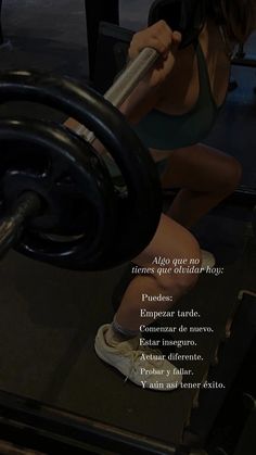 a woman is squatting down with a barbell in her hand and the words above her