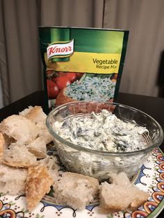 a plate topped with bread and dip next to a box of knorr vegetables