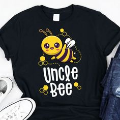 a black t - shirt with a yellow bee on it and the words uncle bee