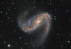 an image of a spiral galaxy in the sky