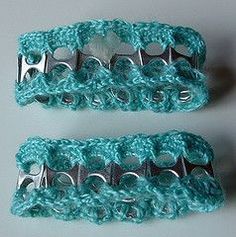 two crocheted hair clips sitting next to each other