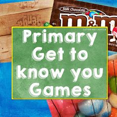 a pile of candy sitting on top of a table next to a sign that says primary get to know you games