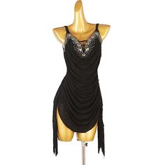 a mannequin wearing a black dress with sequins on the neckline