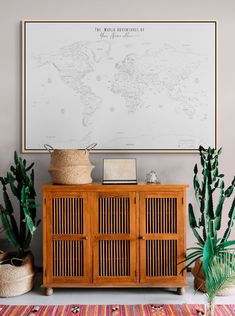 a wooden cabinet sitting in front of a large map