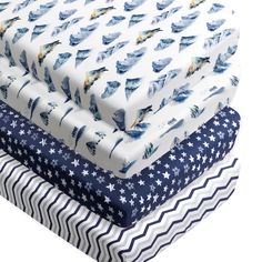 four pieces of fabric with birds and stars on them, all in different colors from blue to white