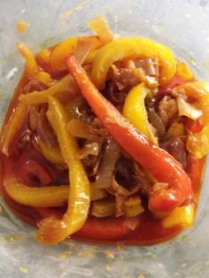 peppers and onions are mixed together in a bowl