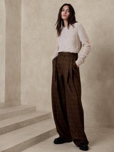 Tailored from Italian wool gabardine, these high-waisted wide-leg pants are cut with a double-pleated front for added ease and comfort.  Relaxed wide-leg fit, super high waisted Fabric sourced from Italy's Marzotto Mill Zip fly with hook-and-bar closure Front and back pockets Unlined Relaxed wide-leg fit.  Super high waisted.  Full length.  Inseam: Short 28", Regular 30", Long 33" Model: Size 2, 5'10" (178cm). Black Wide Leg Pants, Wide Leg Dress Pants, Classic Pants, Belted Pants, Banana Republic Pants, Vintage Pants, Wool Pants, Italian Fabric, Wool Dress