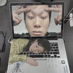 an open laptop computer sitting on top of a desk