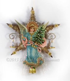 a christmas ornament with an angel holding a tree