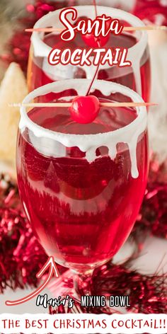 two glasses filled with red liquid and topped with a cherry on the top, surrounded by confetti