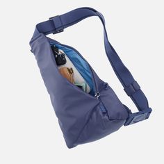 a blue bag with some items in it on a white background and the bottom part of the bag is empty