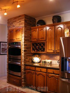 a kitchen with wooden cabinets and stainless steel appliances