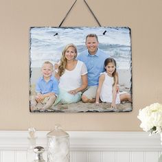 a family photo hanging on the wall