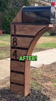 a wooden mailbox with the words after written on it and an image of a house in the background