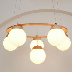 three circular lights hanging from the ceiling in a room