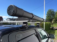 a car with a telescope mounted on the roof