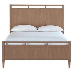 an image of a bed with white pillows and wood headboard on the bottom side