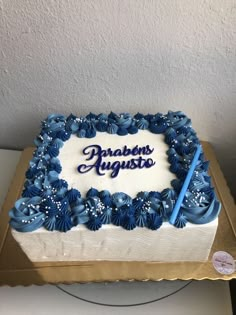 a blue and white cake with the words problems august written in frosting on it