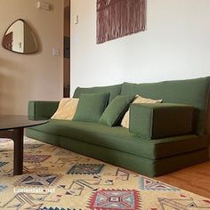 a living room filled with furniture and a rug