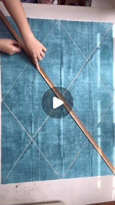 someone is measuring the length of a rug