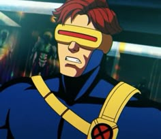 an animated image of a man with blindfolds and red hair wearing a blue suit