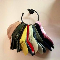 there are many pairs of socks hanging on the hook