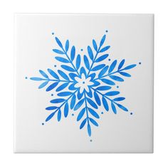 a blue snowflake on white tile